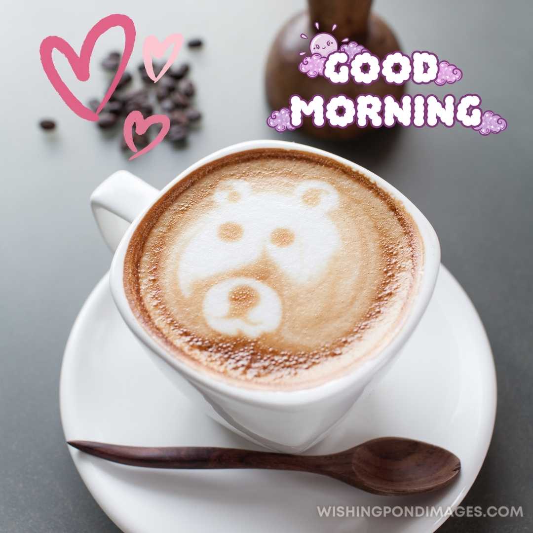 A cup of coffee in the plate with wooden spoon sitting on the table. Good Morning Coffee Images